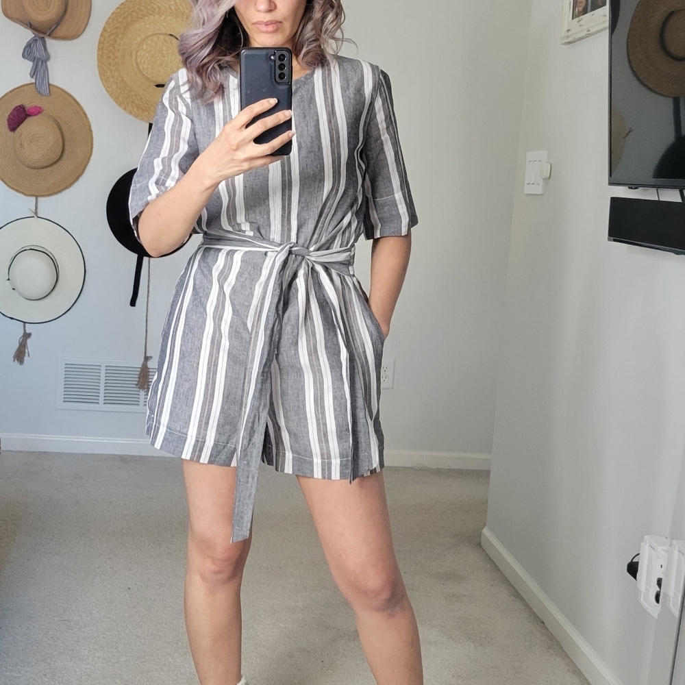 Brand new Romper with a cute bow to highlight your waist